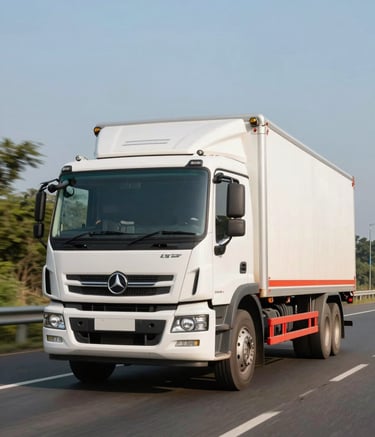 A high-quality commercial photograph of a modern white transport truck with red highlights driving on a scenic highway in Haryana, India, during the bright afternoon sun, symbolizing speed and reliability.
