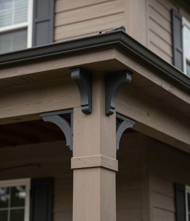 A close-up shot of a meticulously painted exterior of a North American / US home. The composition focuses on the sharp contrast between earthy taupe trim and deep charcoal decorative elements. The finish is flawless, representing high-quality execution and attention to detail.