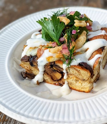 Photo of mushroom and cheesy leek bread pudding with horseradish aioli by Dan Clapson