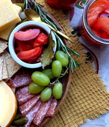 A charcuterie board featuring a pickled stone fruit recipe by Dan Clapson