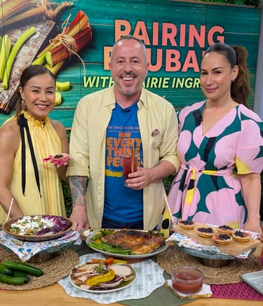 Dan Clapson holding a rhubarb cocktail on The Social set with Cynthia Loyst and Melissa Greco