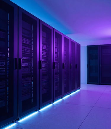 Wide shot of a clean, minimalist server room in North America, bathed in neon blue and deep purple lighting. The architecture is futuristic with sleek metallic surfaces and glowing light strips along the floor.