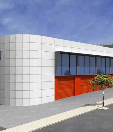 a building with a red door and a car parked in front of it