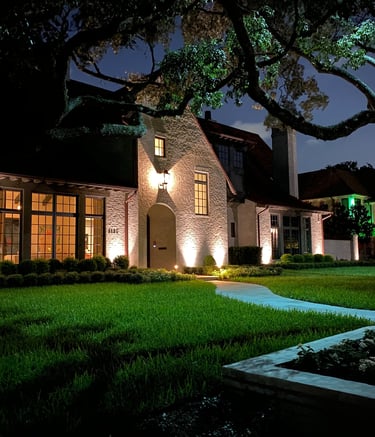 Landscape Lighting front facade of house with a moon light installed in a tree