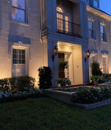up lighting the front facade of a two story home