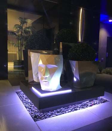 RGB strip lighting installed in hardscape to illuminate walkway and accent feature