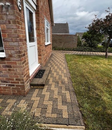 “Professional PJB Exterior Cleaning technician carefully cleaning block paving in Norwich, Norfolk,