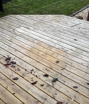 Timber decking professionally cleaned and restored by PJB Exterior Cleaning, showing a fresh and rev