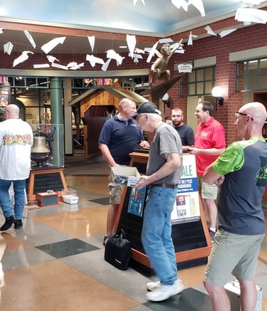 Members displaying models at the Library