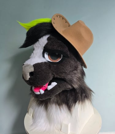 Custom skunk furry head mask with neon green hair wearing a miniature cowboy hat.