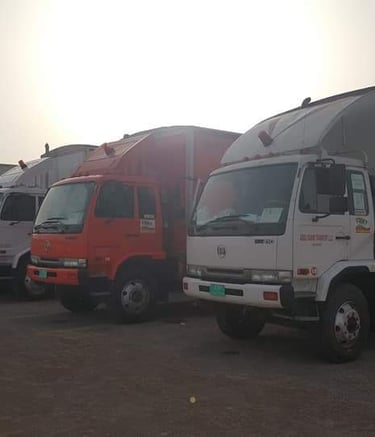 trucks standing at a warehouse