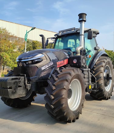 a 260HP tractor with a large tire on the side of the road