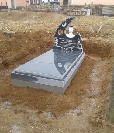 Front view of a Tegg's T19 headstone fitted with a slab