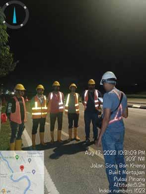 a group of people standing in front of a map of a city