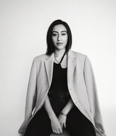 a woman sitting on a chair with her legs crossed