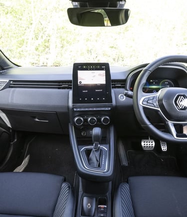 a car dashboard with a steering wheel and steering wheel