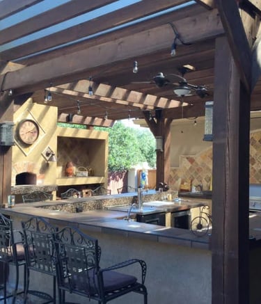 a kitchen with a bar stool and a bar stool