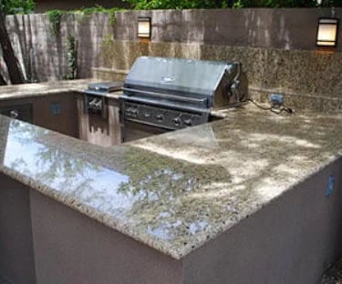 a kitchen island with a grill and a grill