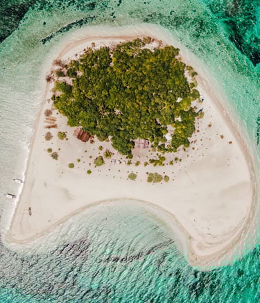 a small island with a small island in the middle of the ocean