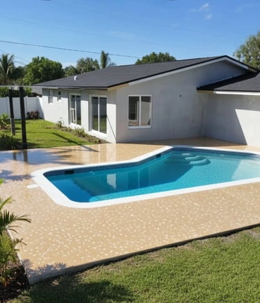 A newly finished backyard with a pristine pool, modern epoxy decking, and vibrant landscaping, 