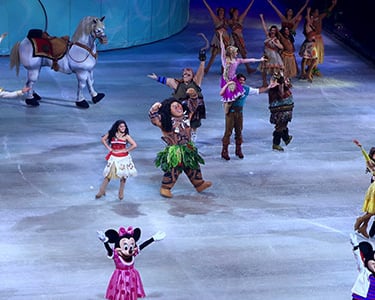 Disney on ice - a group of people in costumes on a stage