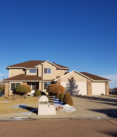 a house with a mailbox and mailbox in the driveway