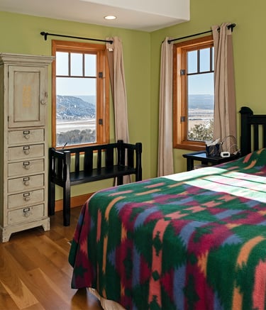 a bedroom with a bed and a dresser