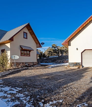 a house with a garage door and a garage door