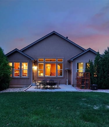 a house with a patio table and chairs