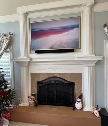 Samsung the frame tv installed over a fireplace