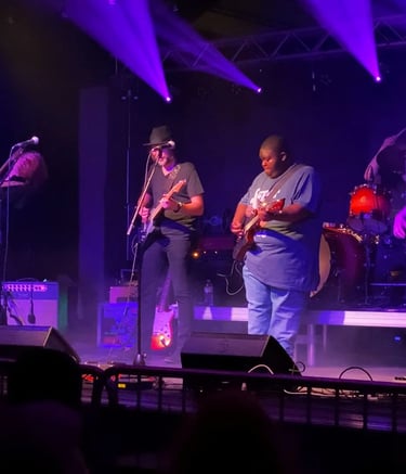 Andy Timmons, Andy Wood, Christone "kingfish" Ingram, Ben Eller, and Andy Campbell on stage playing