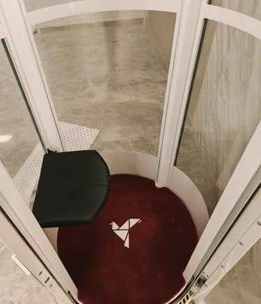 Interior view of vacuum home elevator cabin with seating in Jaipur residence