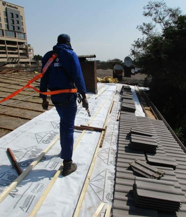 Staff safety harnessed to harness line, safety first, Hyde Park, Sandton