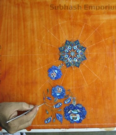 Inlay stones being set into marble