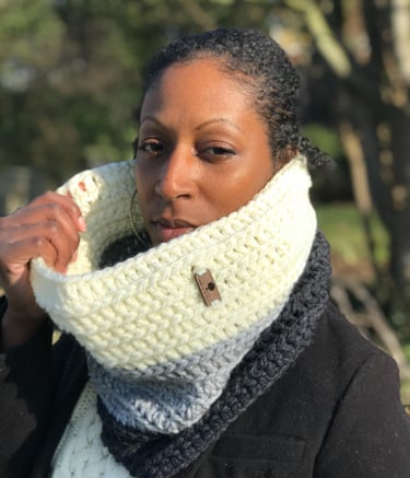 A woman wearing a crochet chunky cowl around her neck