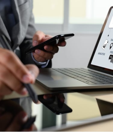 a man in a suit and tie is holding a cell phone