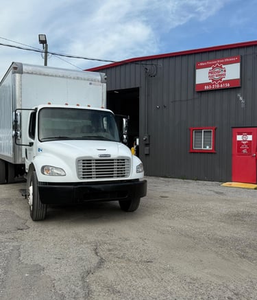 a truck in front of precision fleet services