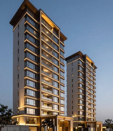 A wide-angle photography shot of a luxury residential complex in Gurgaon at dusk. The architecture is modern and sophisticated, illuminated with soft golden lights. The scene captures the premium feel of the South Asian / Indian property market with a clear evening sky in shades of steel blue.