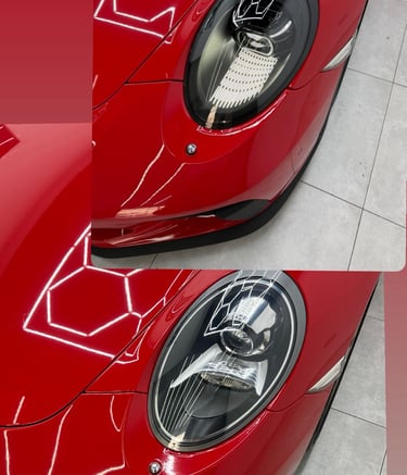 Close-up of a red luxury sports car's LED headlights with honeycomb light reflections on the hood.