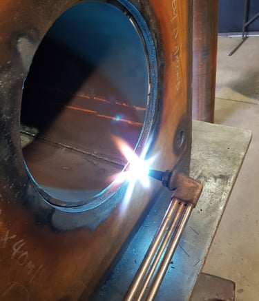preheating a thick metal base before welding