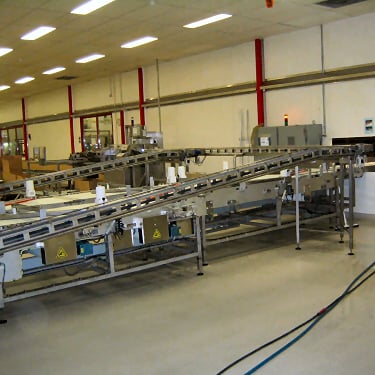 a factory floor with a conveyor belt