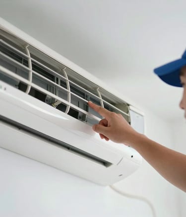 A close-up photograph of a professional technician's hand pointing at a clean, white air conditioning vent. The scene is bright and airy with soft sky blue and navy blue accents. Professional lighting, South American / Brazilian setting.