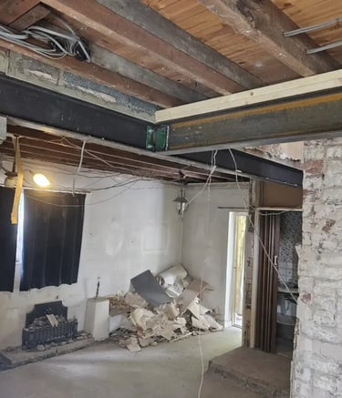 Structural steel RSJ beam installed in a home renovation to support an open plan layout.
