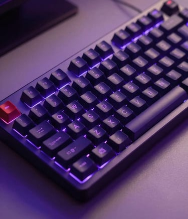 A close-up photograph of a sleek mechanical keyboard on a minimalist desk, illuminated by vibrant electric purple and deep navy ambient lighting, suggesting a high-tech coding environment.