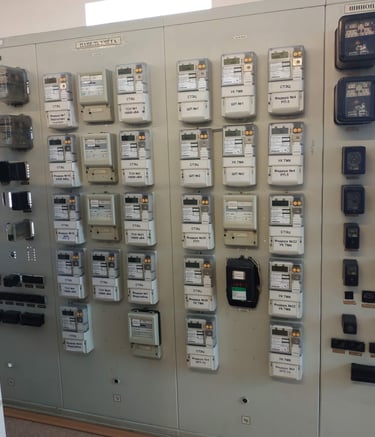 a control panel with a lot of electrical equipment со счетчиками Альфа А1800
