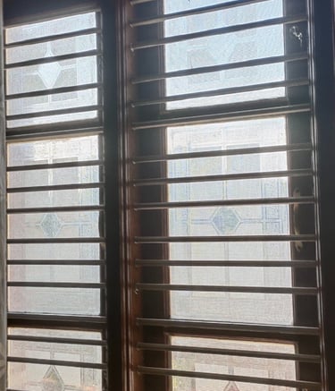 Wide shot of a modern Bangalore balcony with a securely installed mosquito net.