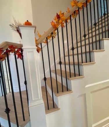 painted and stained staircase. professional interior painting and staining. red deer.