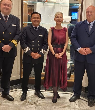 Managerial river crew posing in formal uniforms.