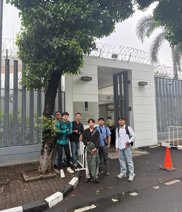 crew standing outside Netherland embassy after visa application