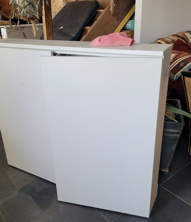 a refrigerator freezer with a refrigerator and a couch